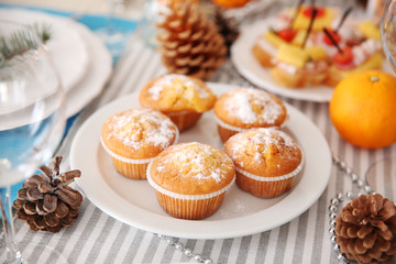 Tasty muffins in a Christmas dinner table