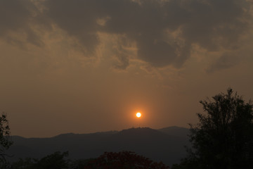 sunset on mountain hill