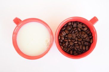 Two cups with coffee and milk