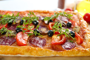 Rectangle delicious pizza on the table, close-up