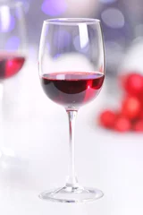 Fotobehang Wineglasses on blurred lights background © Africa Studio