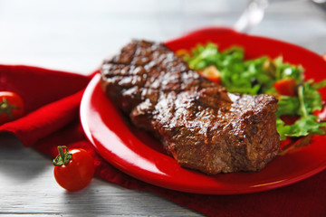 Grilled steak with vegetable salad, closeup