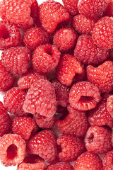 sweet raspberries on a white background