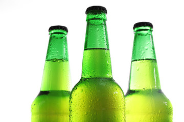 Bottles with fresh beer isolated on white