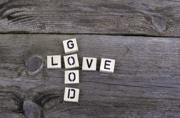 Text: Good Love from wooden letters on wooden background