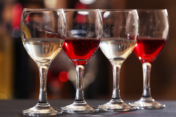 Glasses of red and white wine closeup