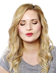 Naklejka premium Beautiful blond woman with kissing lips. Positive Emotions. Young woman with copy space, isolated on white background.