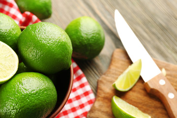 Fresh limes on cutting board