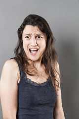 portrait of fear for disgusted young woman expressing fear