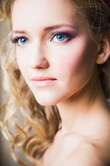 close-up portrait of beautiful blonde bride model with perfect make-up and hair style