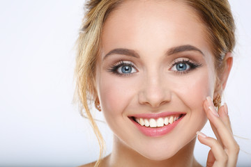 Fototapeta premium Portrait of beautiful woman on white background