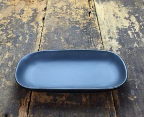 Empty dish plate on wooden background