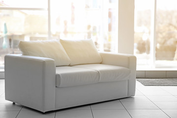 White sofa in a room.