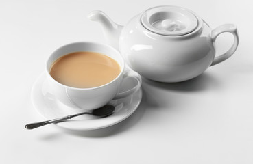 Obraz na płótnie Canvas Milk tea with tea pot on white background