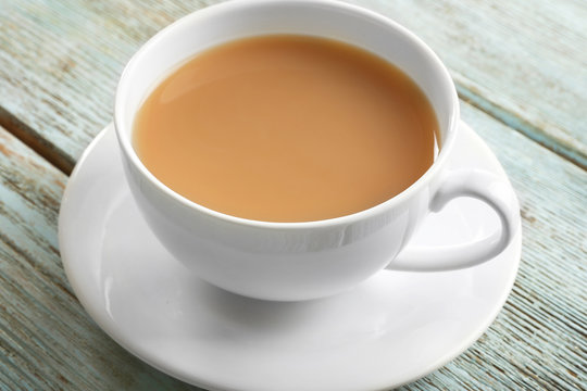 Milk tea on white rustic background.