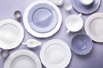 Empty dishes on grey background.