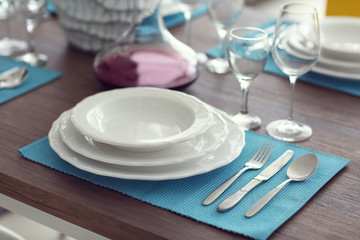 Table served with dishes, close up