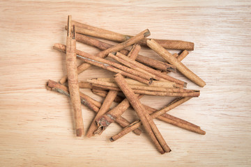pile of cinnamon stick on a wood background