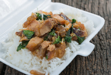Crispy pork with Basil fried rice in foam box