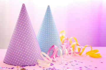 Party hats on bright background