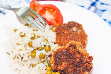 chicken meatballs with spicy rice on white plate
