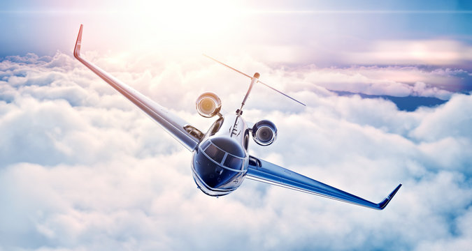 Picture of black luxury generic design private jet flying in blue sky at sunset. Huge white clouds background. Business travel picture. Horizontal, top view. 3d rendering