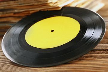 Old vinyl record with yellow label, close up