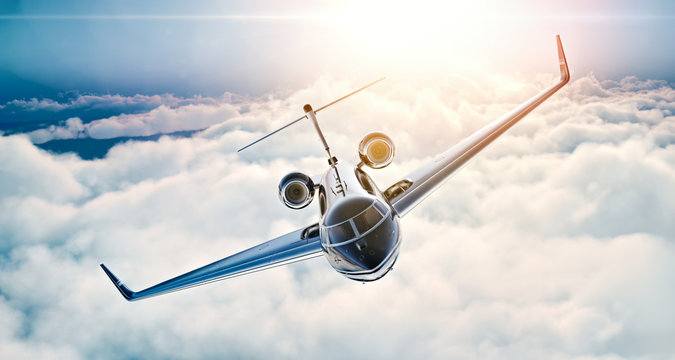 Image of black luxury generic design private jet flying in blue sky at sunset. Huge white clouds background. Business travel concept. Horizontal . 3d rendering