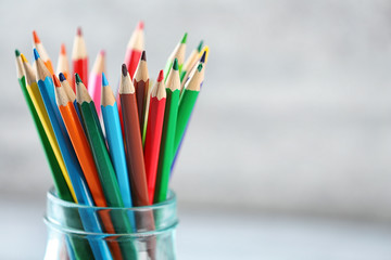 Obraz premium Pencils in glass jar on blurred background