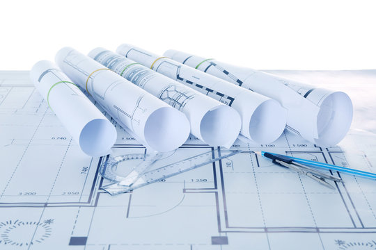 Set of construction blueprints with tools closeup