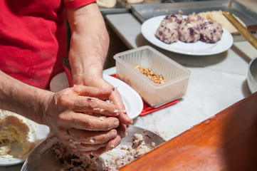 The making of sicilian rice arancini