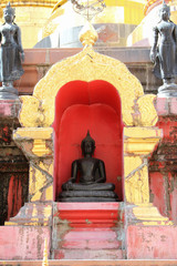 Old buddha statue inside chedi, Phrae, Thailand.