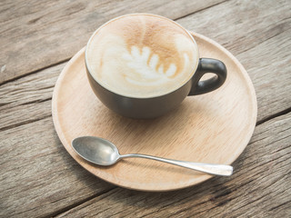 Delicious morning cups of latte coffee on the wooden table rusti