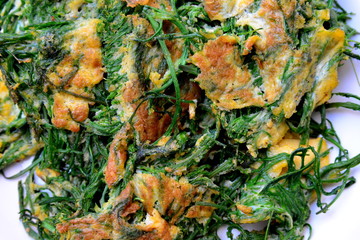 Cha-om Omelet in white plate(Acacia Pennata Omelet); Thai traditional food