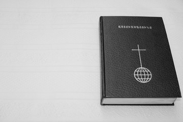 Bible black closed isolated book , black white picture