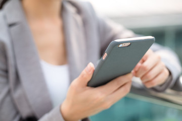 Businesswoman use of mobile phone