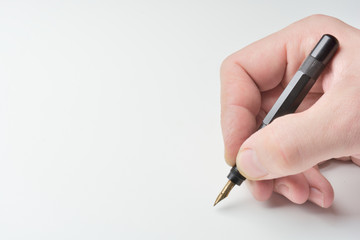 pen in the man's hand to signature