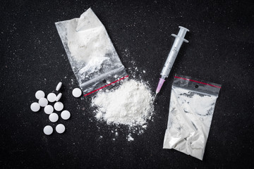 Hard drugs on dark table