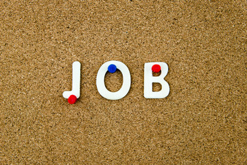 Word JOB made of wooden letters on cork board