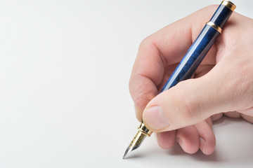 pen in the man's hand to signature