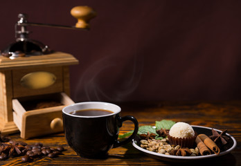 Cup of Coffee with Grinder and Plate of Garnishes