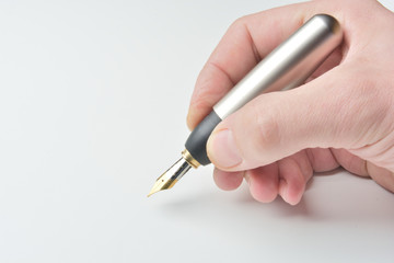 pen in the man's hand to signature