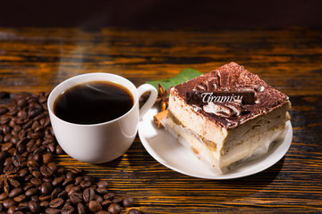 Cake slice in plate with coffee and beans