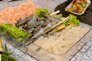 Raw Fish and Seafood in Tray at Buffet Grill