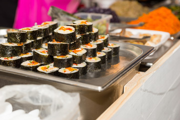 Sushi Rolls Chilling on Tray in Restaurant Buffet