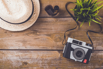 Retro camera on an old wooden table