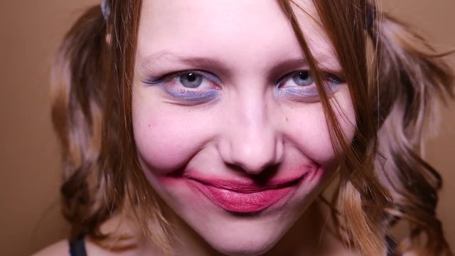 Scary teen girl looking  angry and have a sinister laugh. 4K UHD