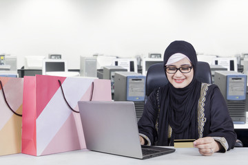 Businesswoman doing shopping online at office