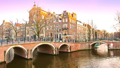 View of the canals with bridge and typical Dutch houses in Amsterdam, Netherlands