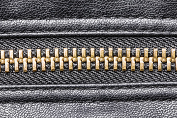 Metal zipper with leather jacket. © Paweł Michałowski
